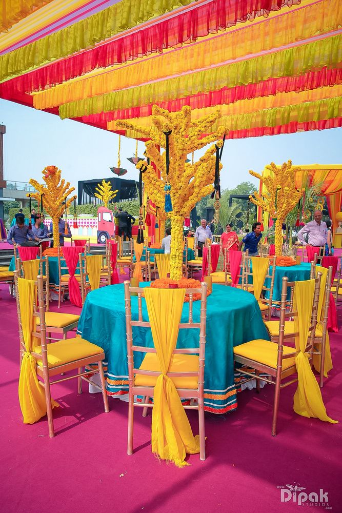 Photo of Yellow and turquoise mehendi decor