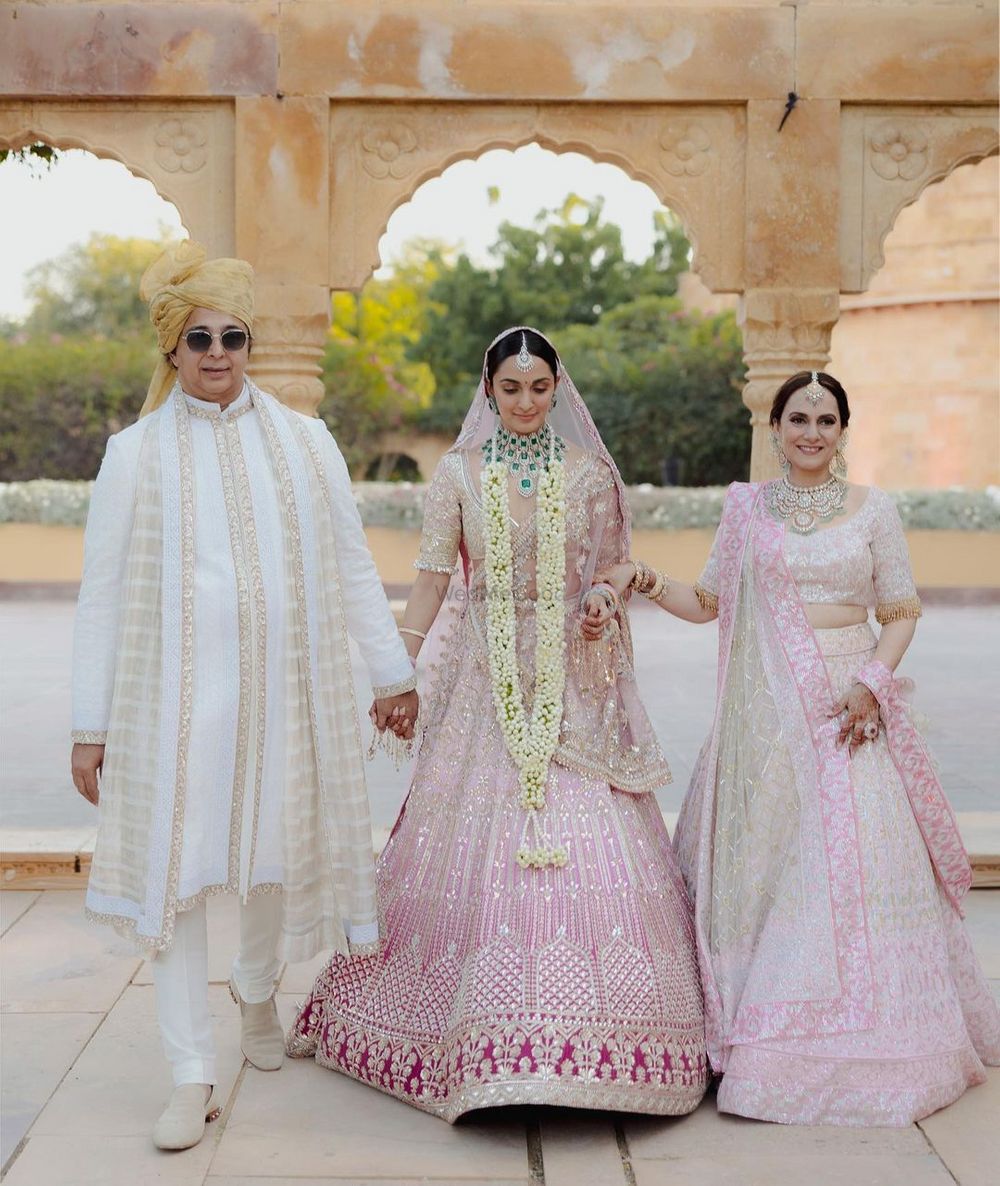Photo of kiara advani wedding bridal entry portrait with mom and dad
