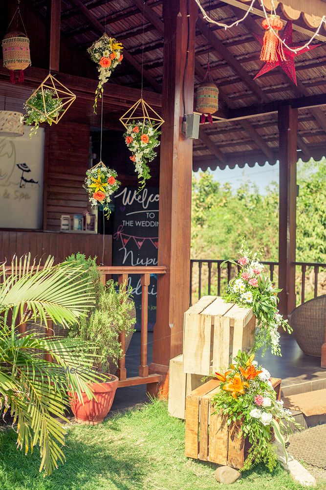 Photo of Wooden crates with florals spilling out