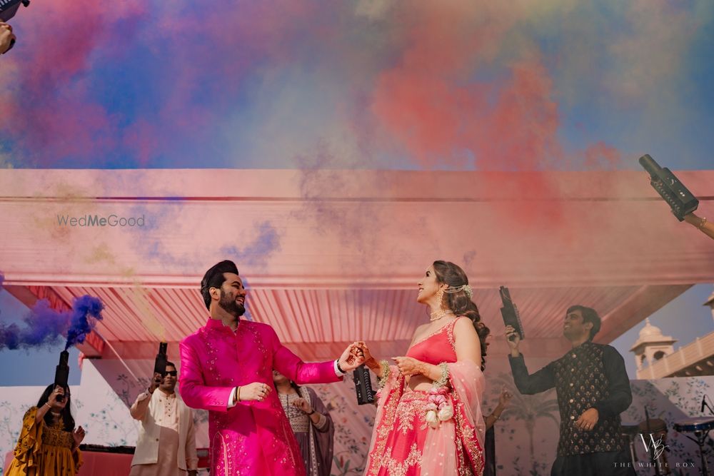 Photo of Fun couple entry with colourful smoke bombs for the pre-wedding ceremony