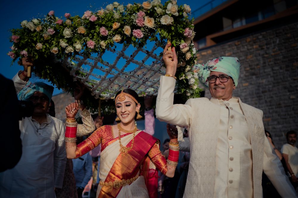 Photo of bridal entry under phoolon ki chaadar.