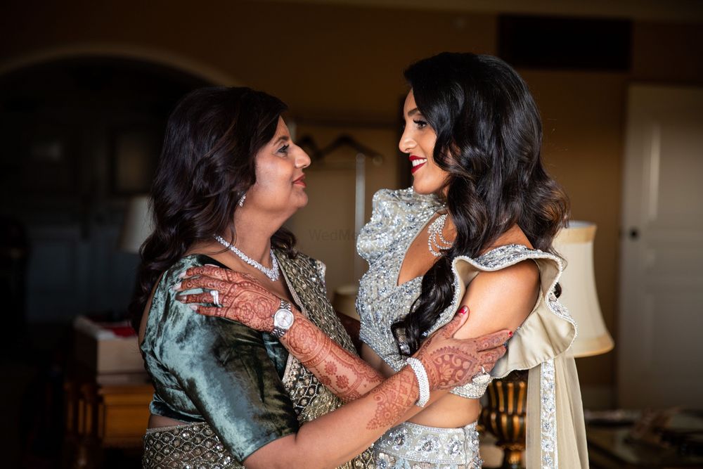 Photo of cute shot of bride with her mother on her sangeet