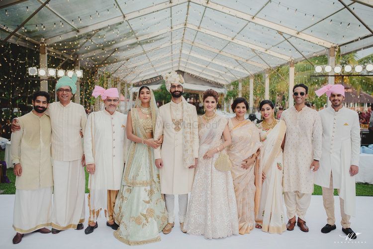 Photo of Coordinated family in pastel wedding photo