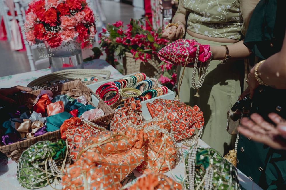 Photo of Bright bangles and potlis as a Mehendi favor.