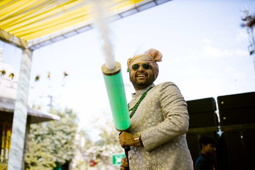 Photo of groom entry idea with smoke bomb