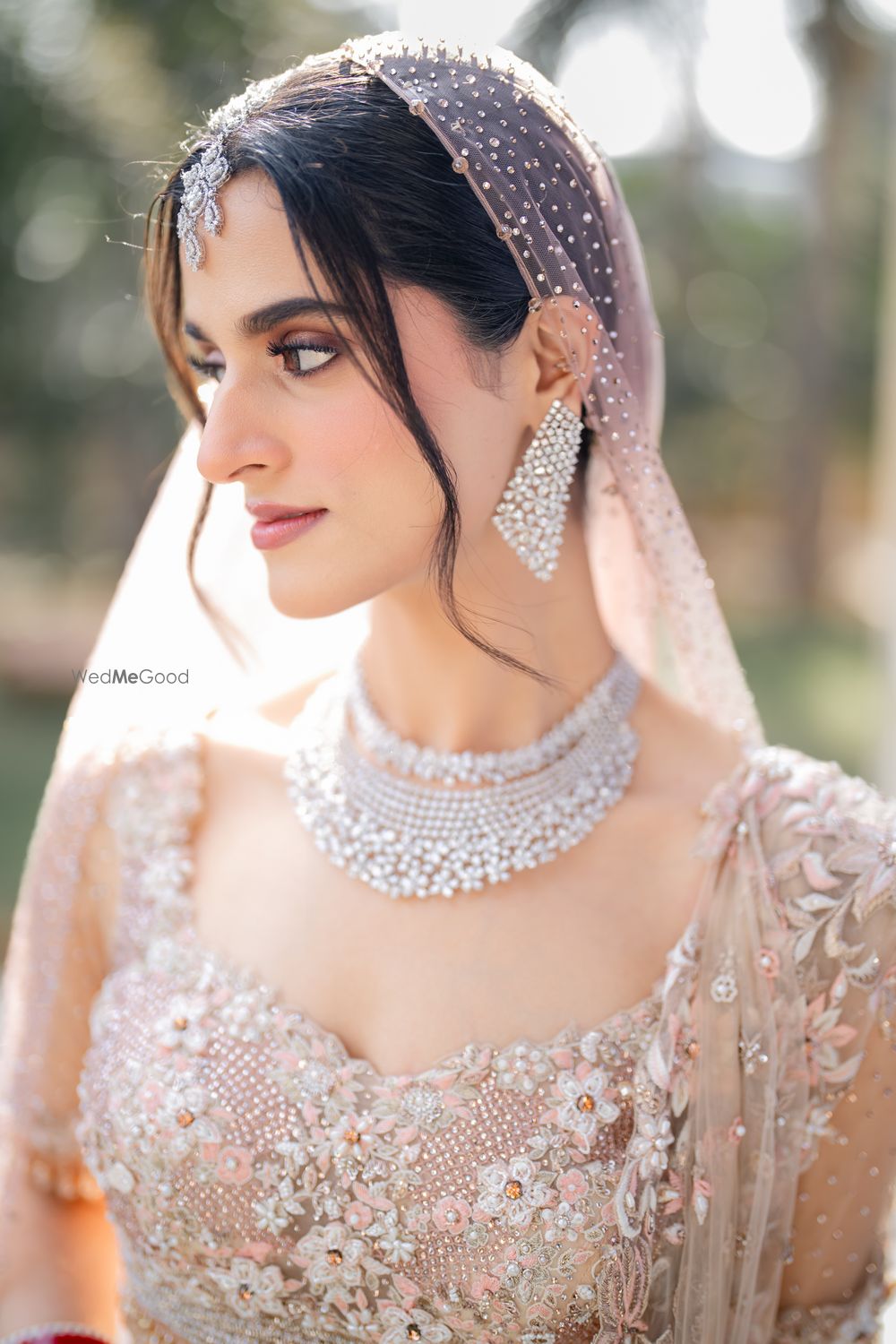 Photo of Stunning closeup shot of the bride in gorgeous makeup and lovely diamond jewellery