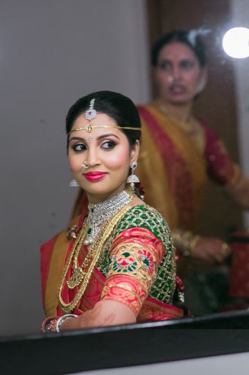 Photo of South Indian Bride Wearing Green and Pink Saree