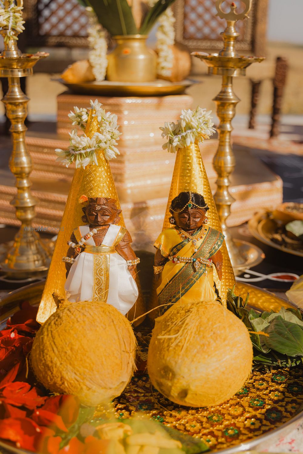 Photo of Adorable shot of the wedding day rituals with bride and groom minitaures