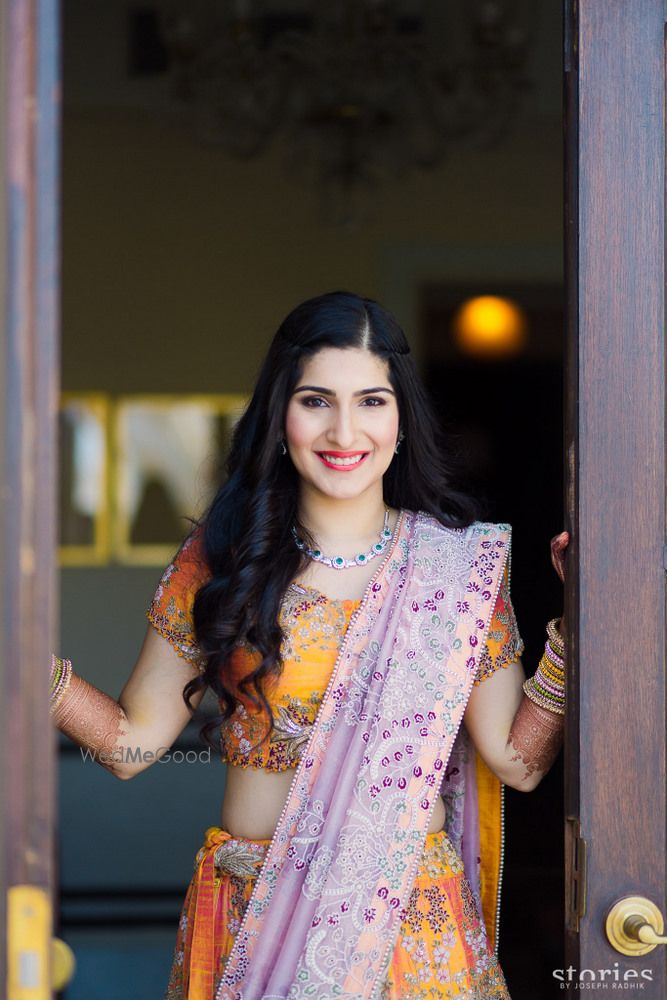 Photo of Bride in yellow and lavender anamika khanna lehenga