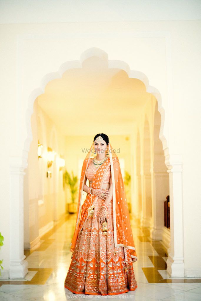 Photo of Orange and gold bridal lehenga for bride