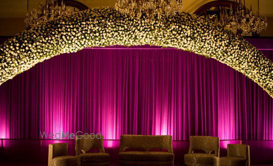 Photo of lavender and gold stage decor