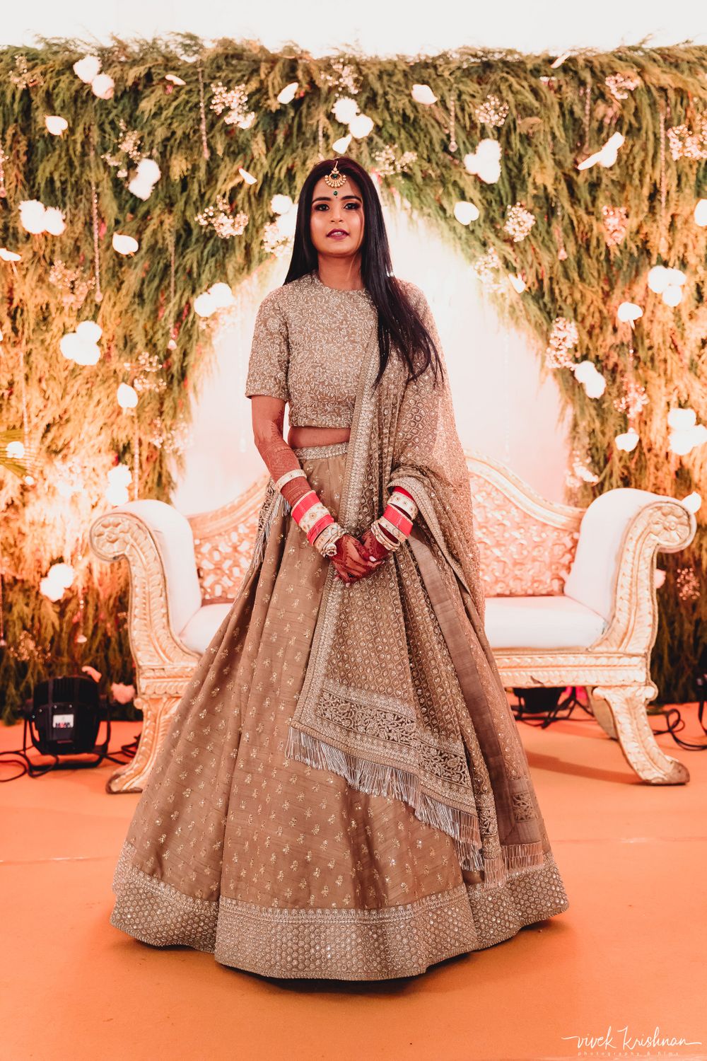 Photo of A bride in a silver lehenga for her reception