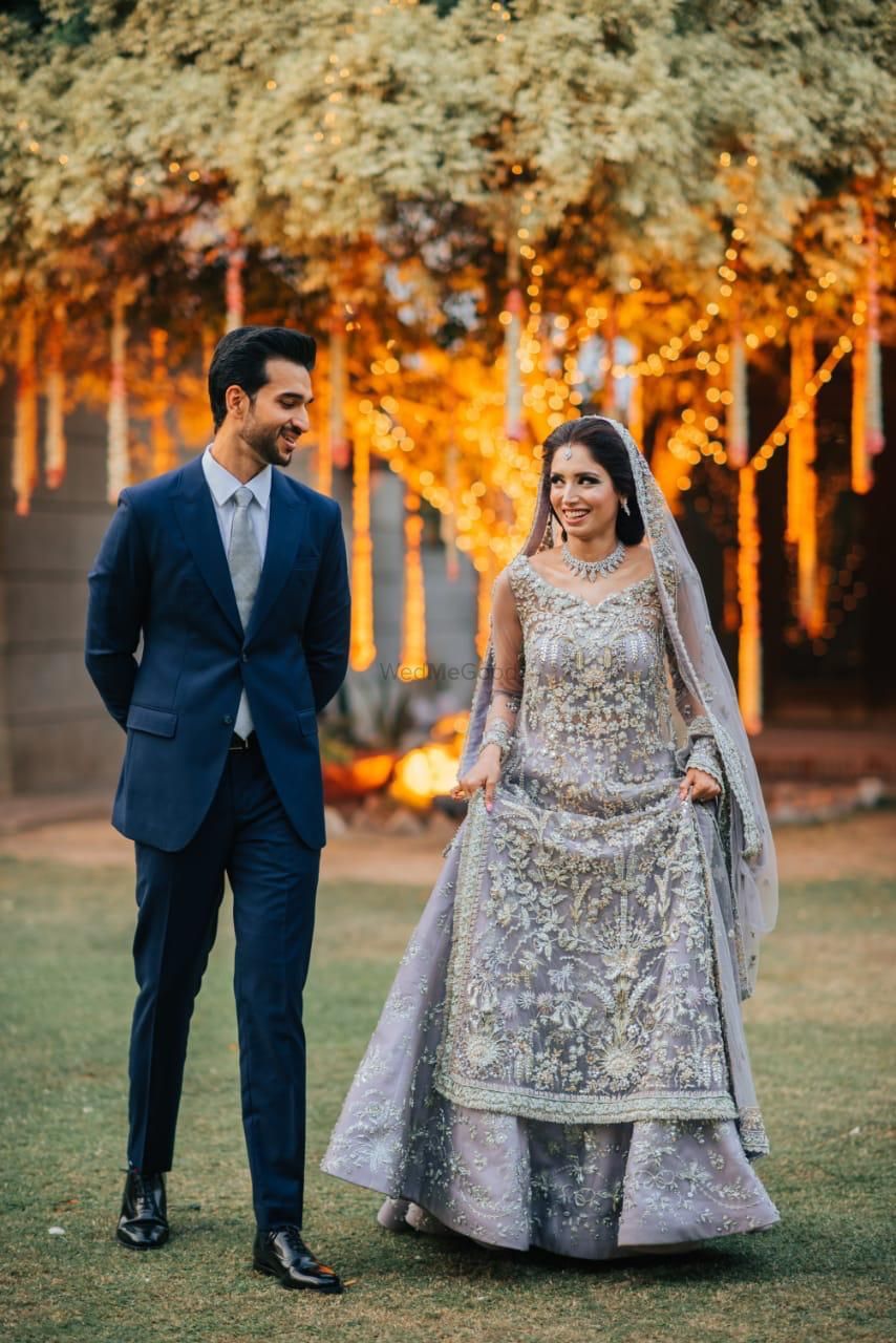 Photo of A candid shot of a bride and groom looking at each other.