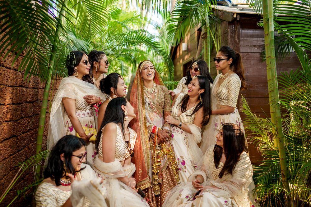 Photo of candid brides and bridesmaids shot outdoors