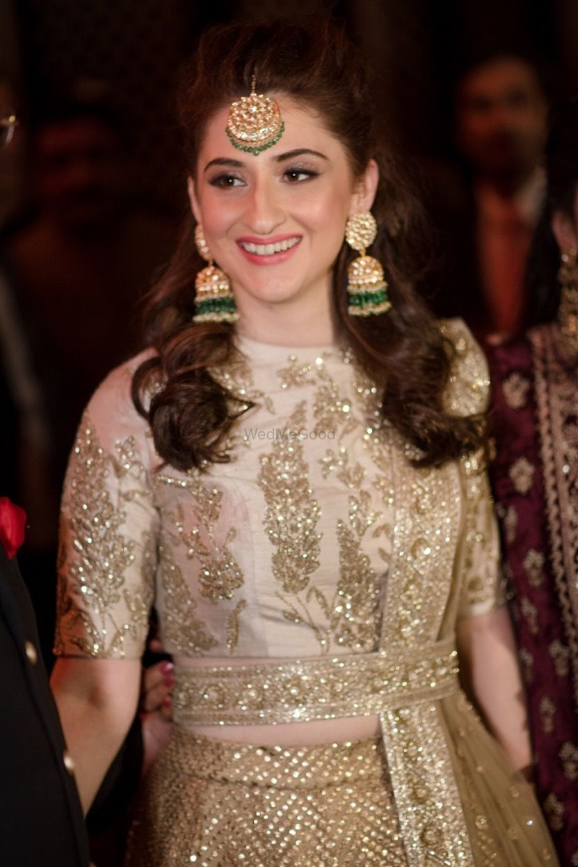 Photo of Sangeet lehenga with gold waist belt