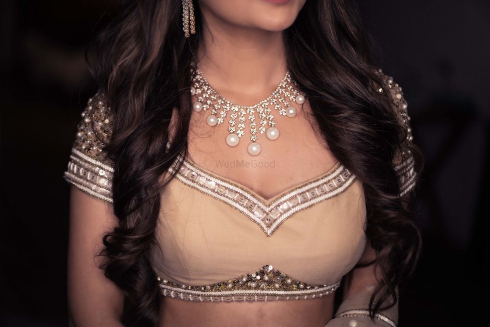 Photo of bridal blouse with pearl and diamond necklace