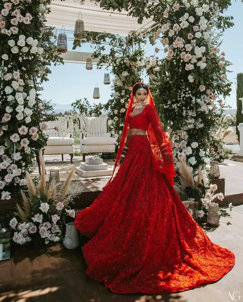 Photo of bride in a modern red lehenga by seema gujral