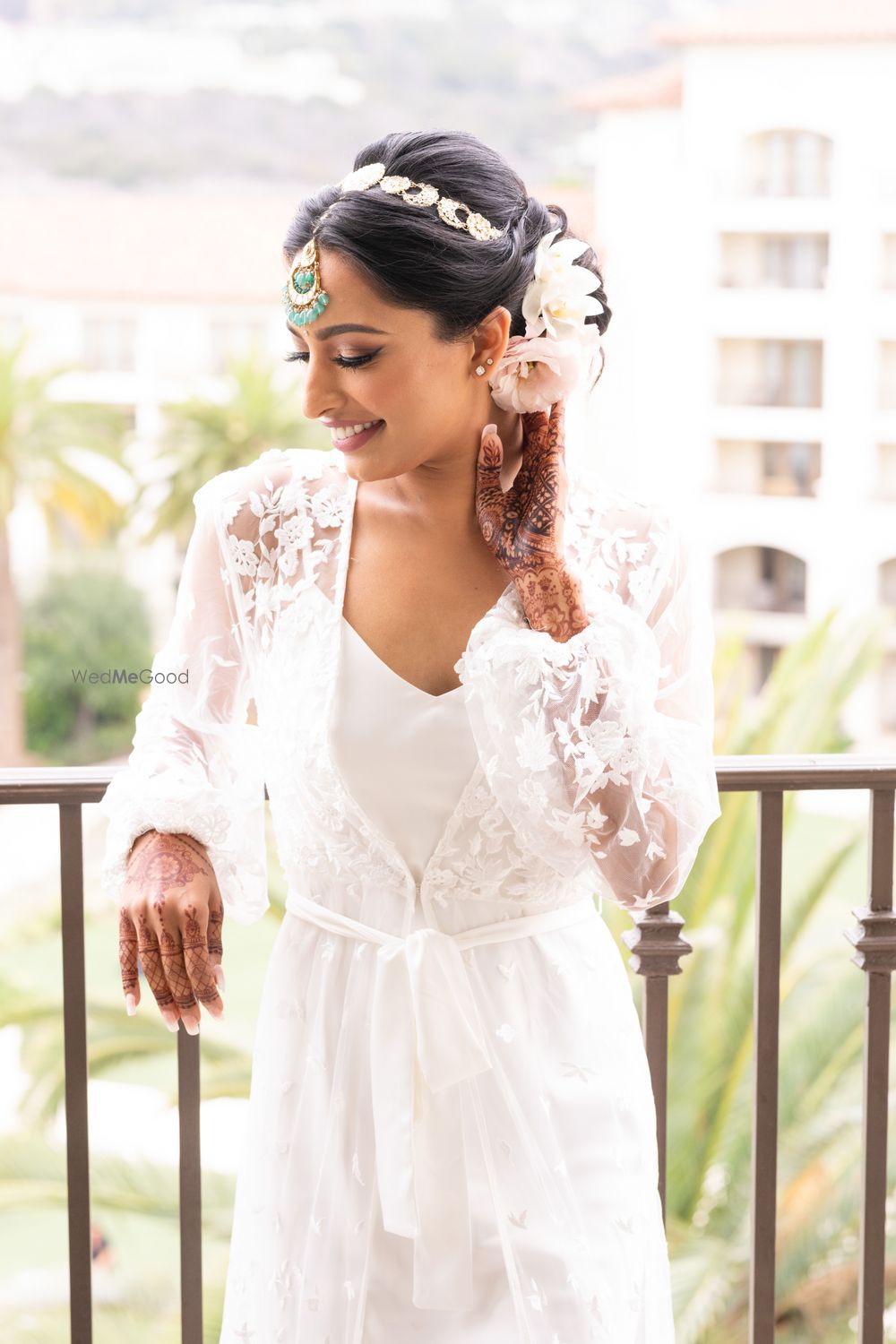 Photo of Bride getting ready shot with bridal bun with white roses