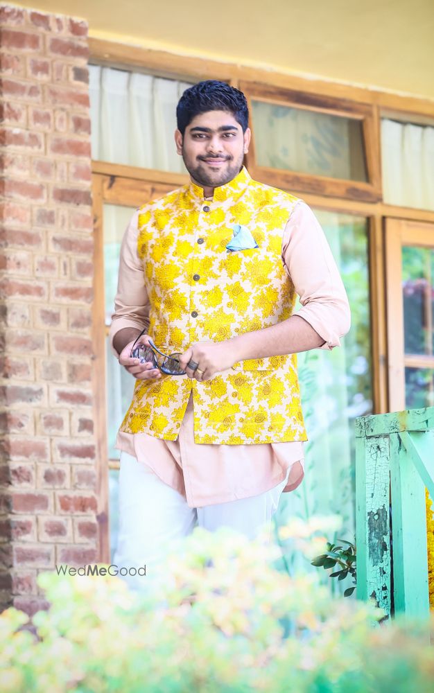 Photo of Yellow nehru jacket with kurta on mehendi