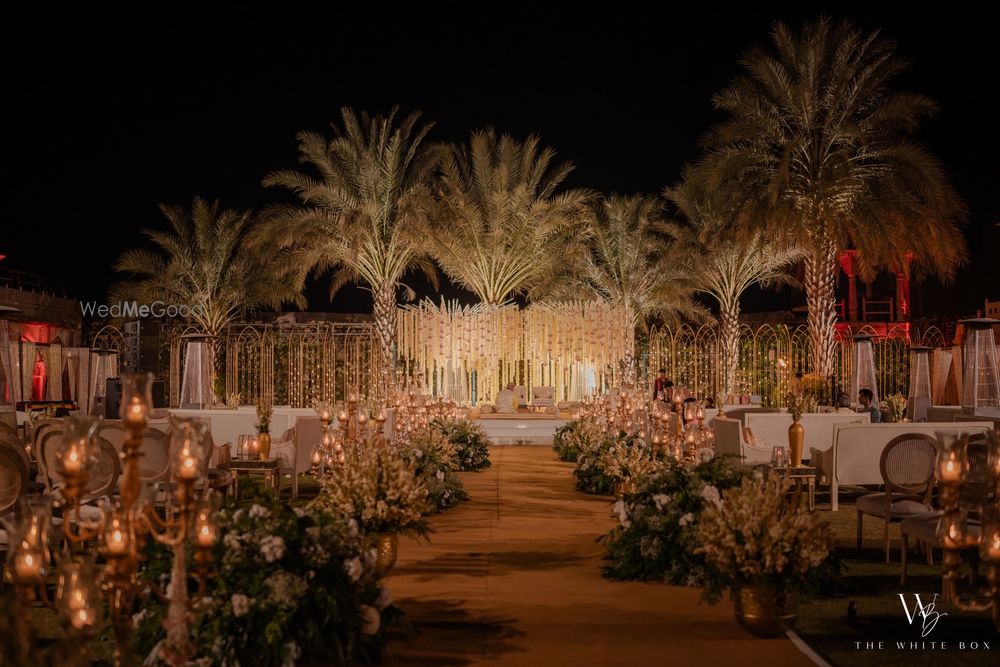 Photo of Gorgeous floral decor for this night wedding with candles and floral elements