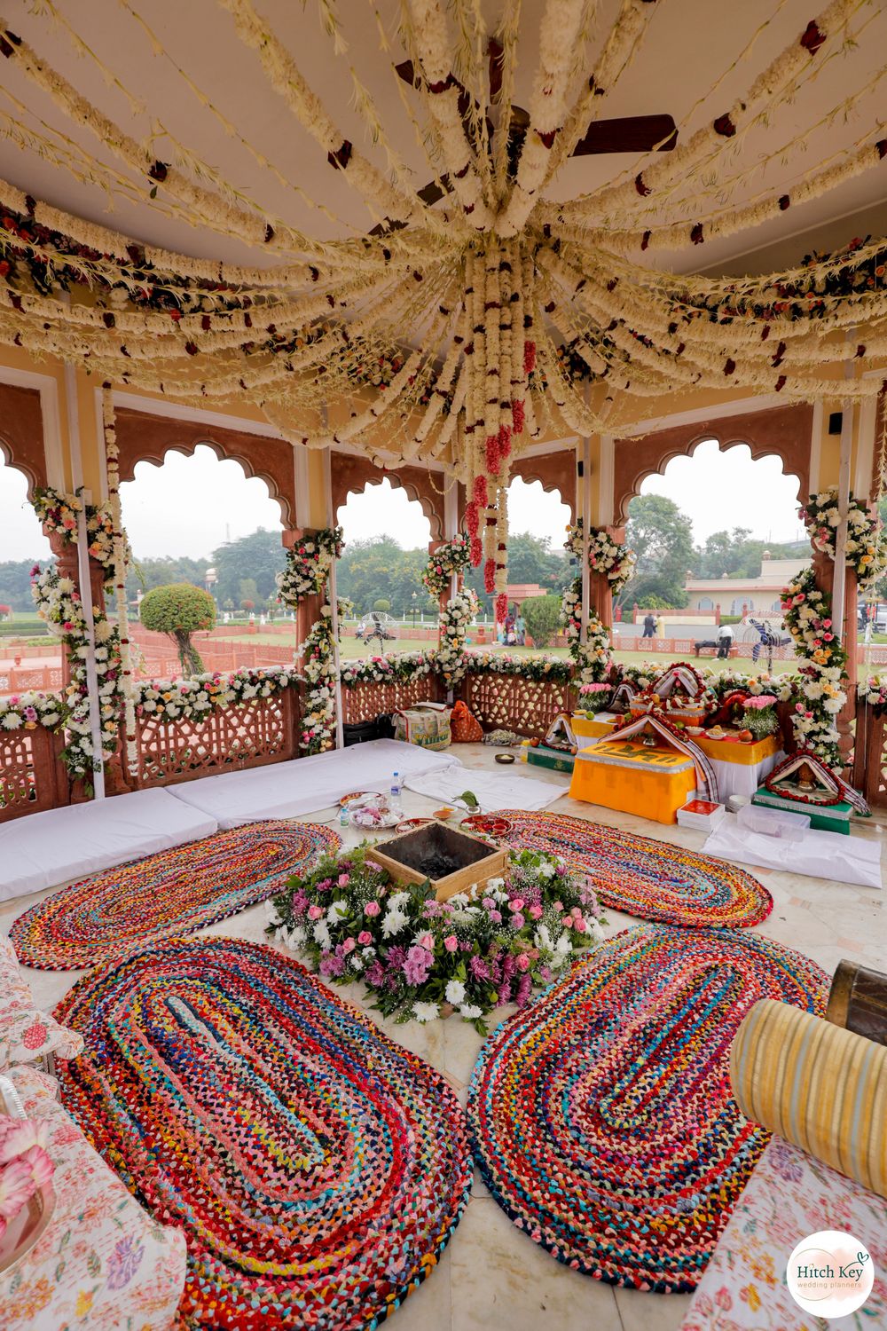 Photo of Unique Mandap decorated with floral setup of roses, lilies, and other pastel blooms