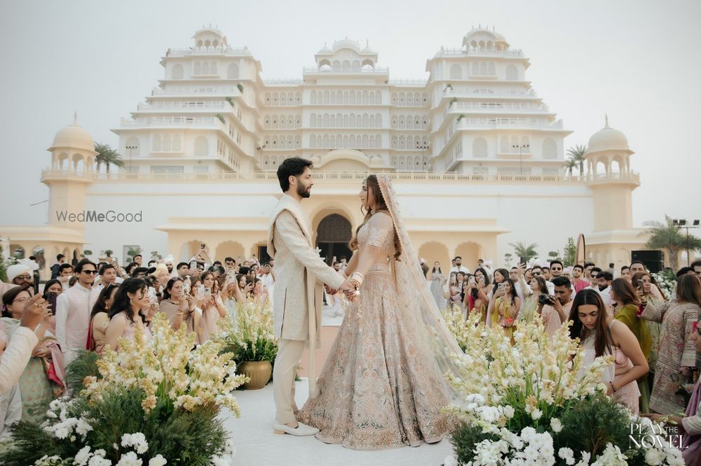 Photo of Stunning floral decor for the garland exchange stage against a royal backdrop