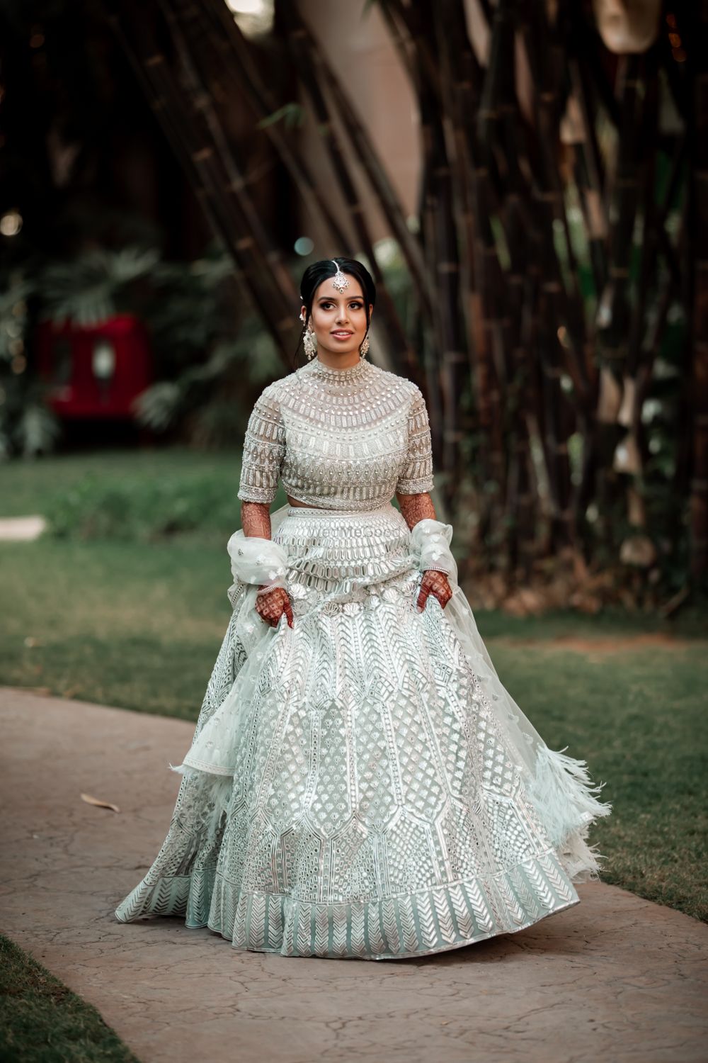Photo of Bride wearing a silver lehenga on engagement.