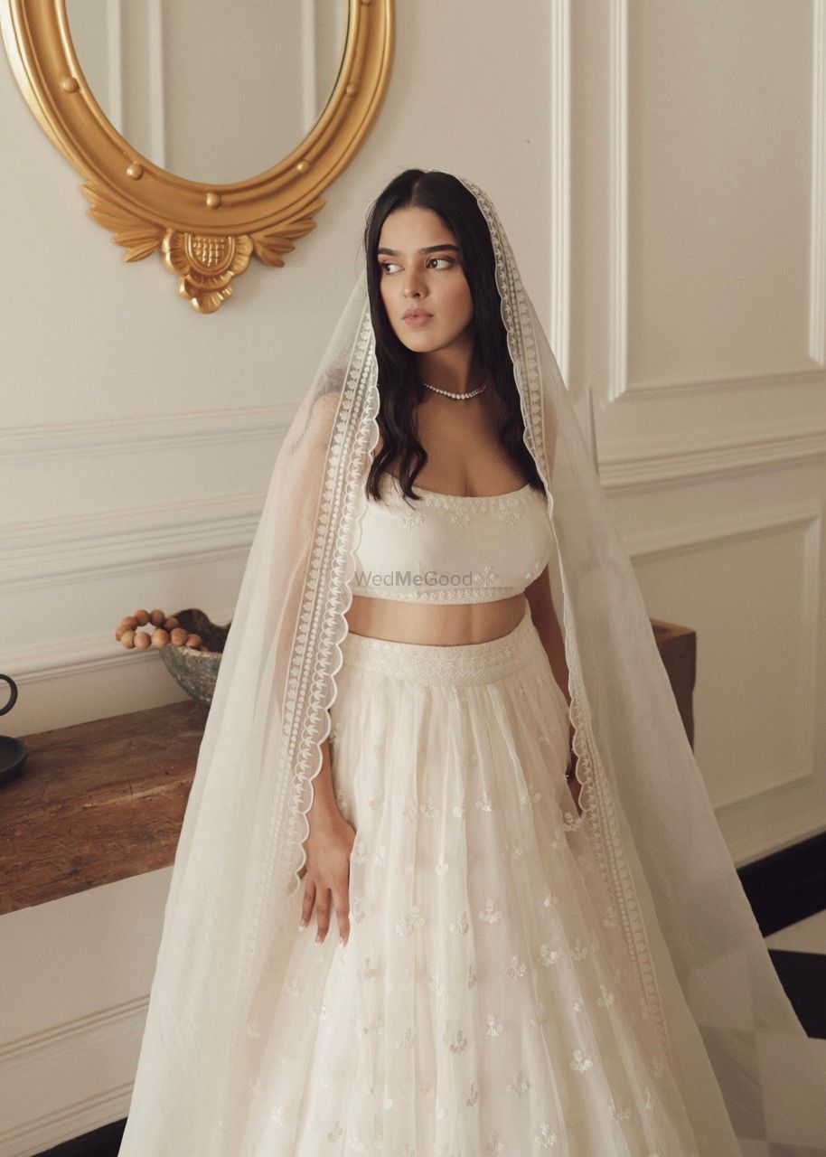 Photo of Bride in a white lehenga for her engagement