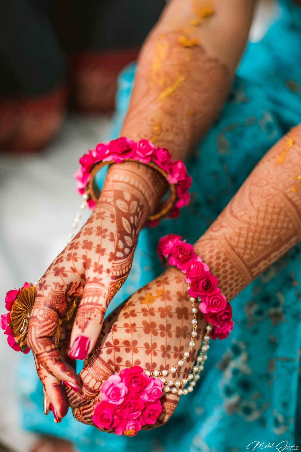 Photo of Mehendi hands with pink floral haathphool