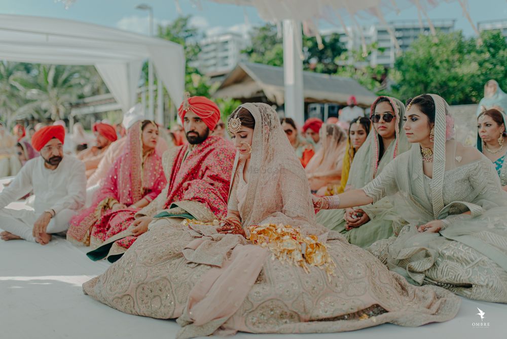 Photo of A shot of the bride and groom during the Anand Karaj
