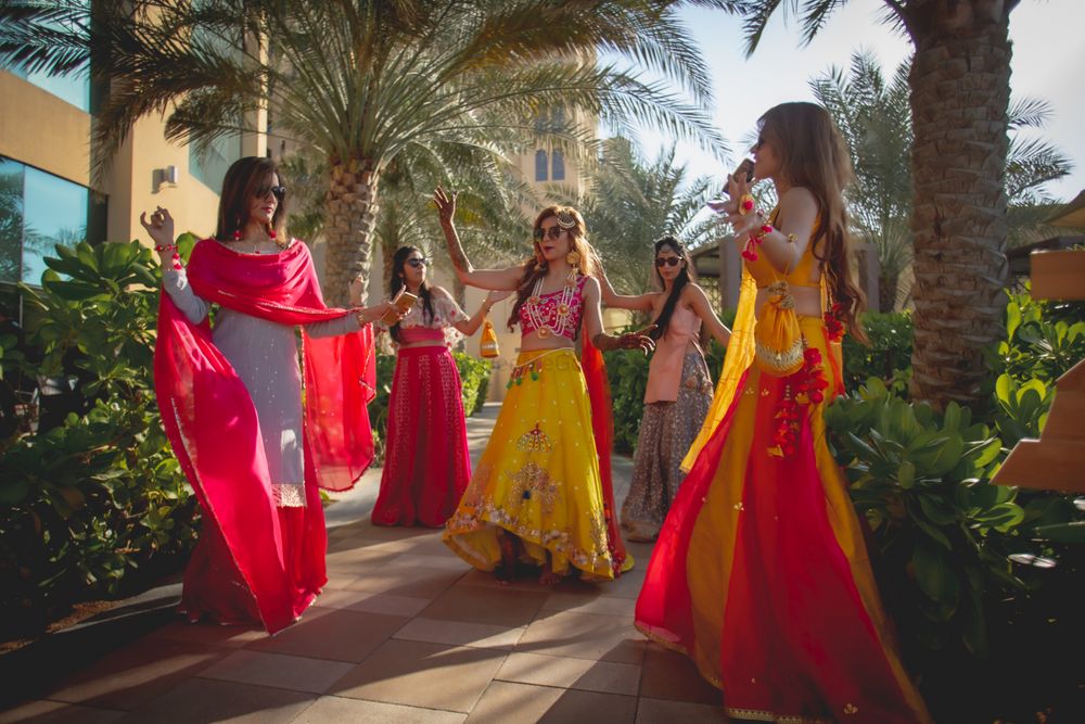Photo of Bride celebrating with bridemaids on the mehedi day