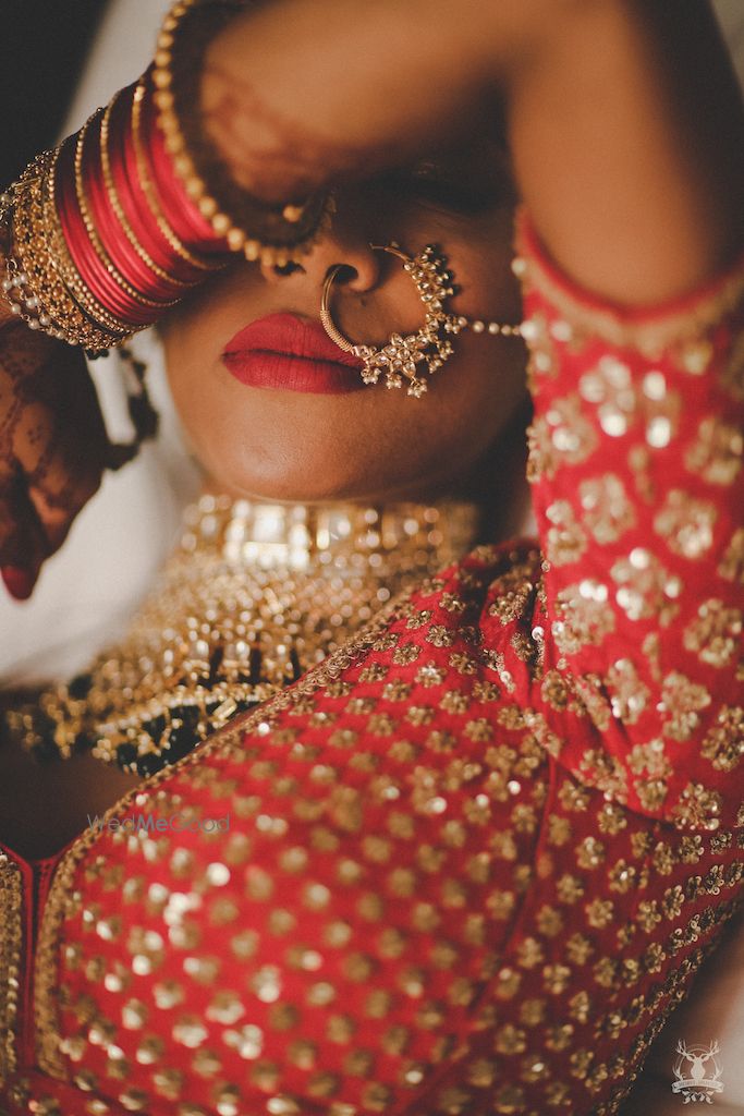 Photo of Unique bridal portrait showing off jewellery