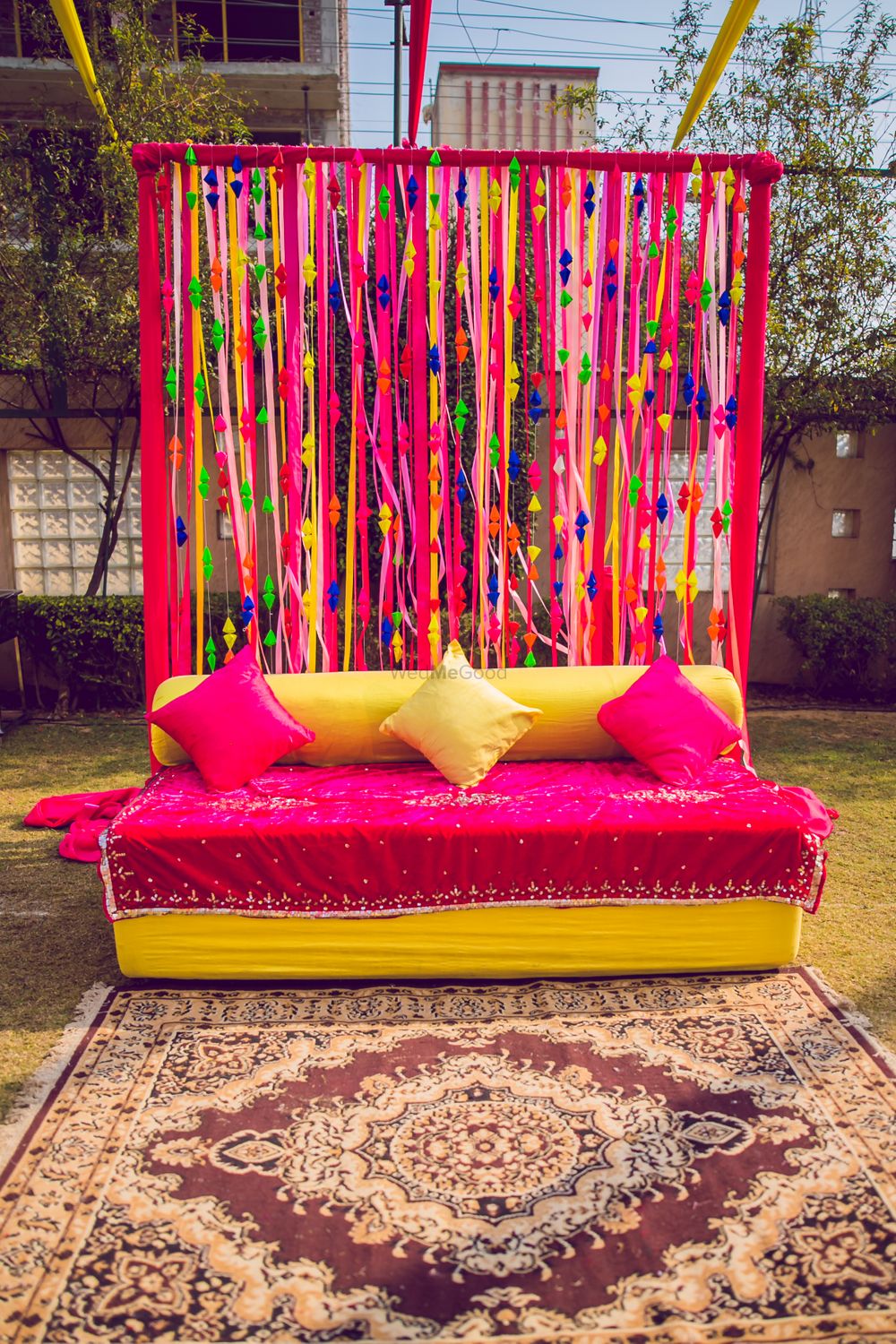Photo of Colourful haldi decor with a bright pink theme.