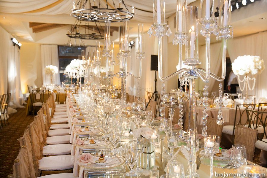 Photo of Gold and white glamorous wedding reception table
