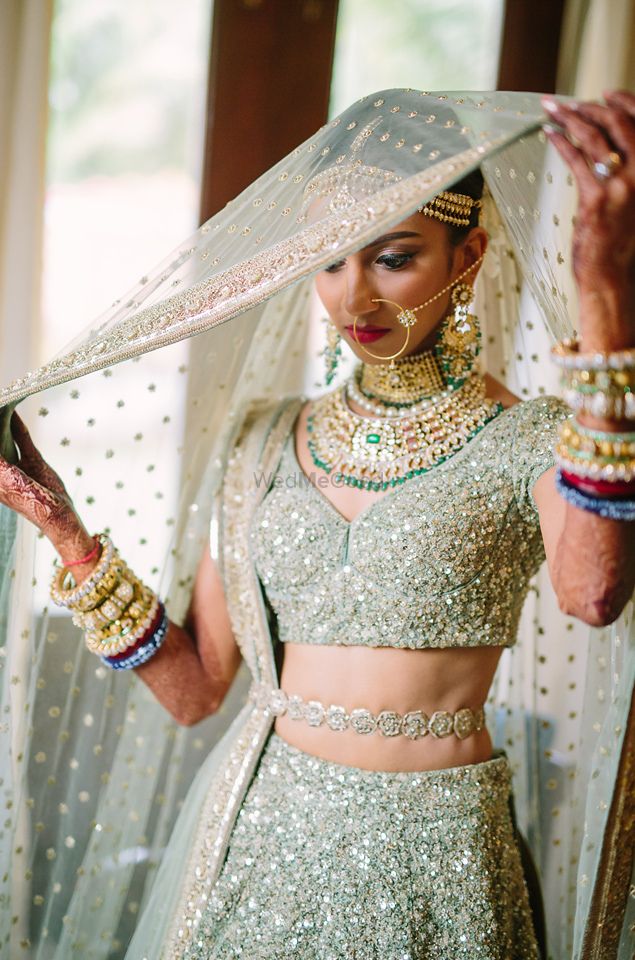Photo of Shimmery bridal lehenga with waist belt