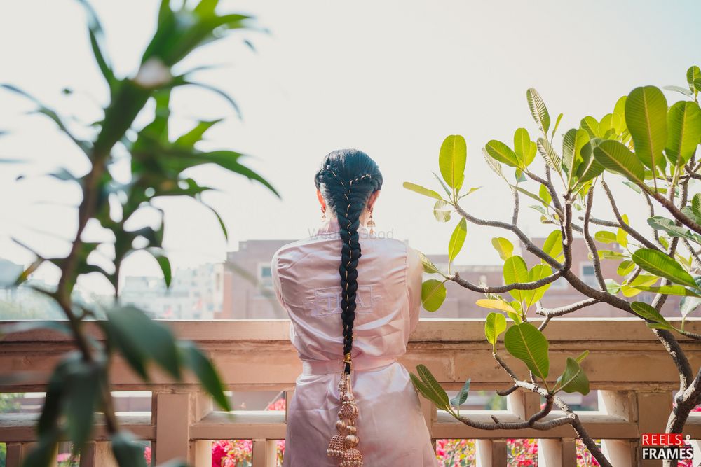 Photo of long braided hairstyle with paranda for punjabi/sikh brides