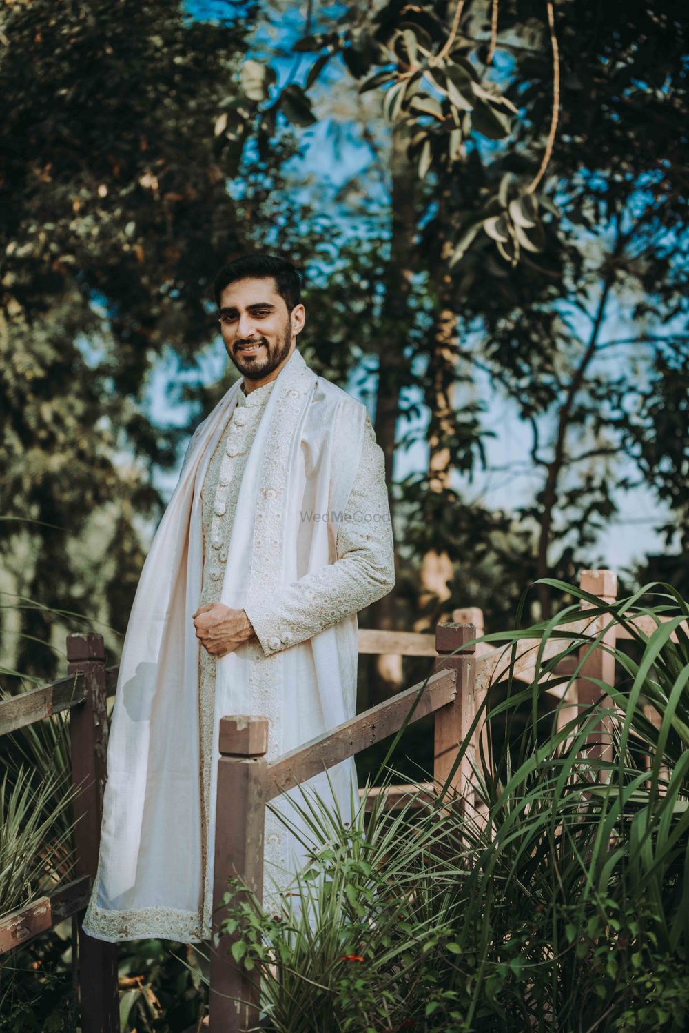 Photo of gold and ivory sherwani for a groom for intimate wedding