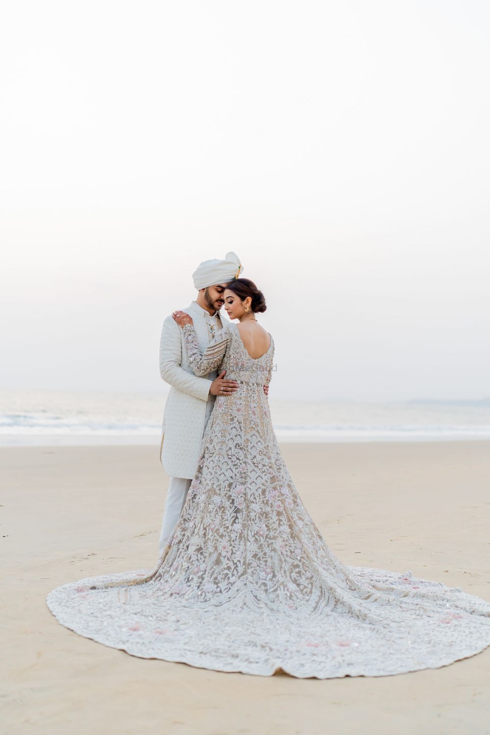 Photo of all white couple wedding day look