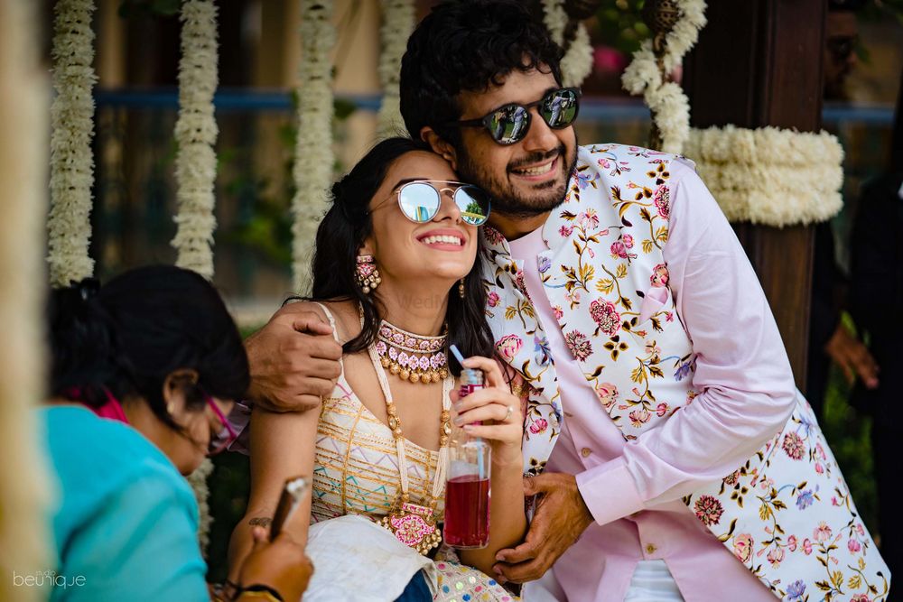 Photo of Mehendi couple shot with both wearing sunglasses
