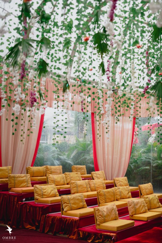 Photo of seating arrangement with floral strings around the mandap