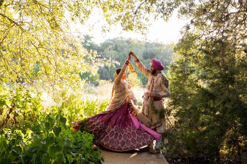 Photo of twirling brides