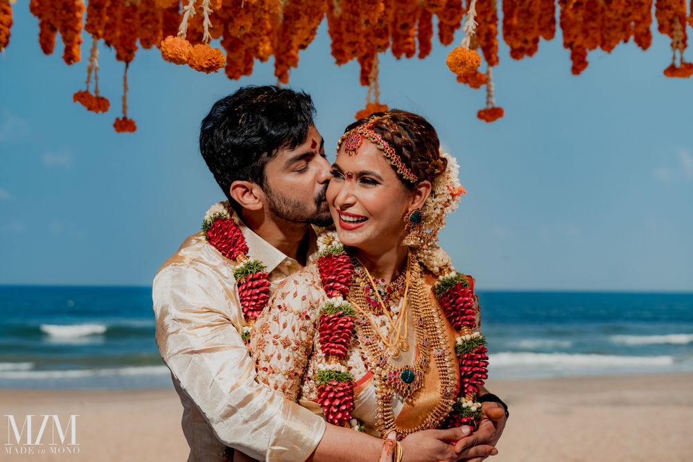 Photo of bright and happy south indian couple shot