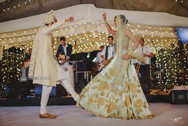 Photo of Dancing bride and groom portrait