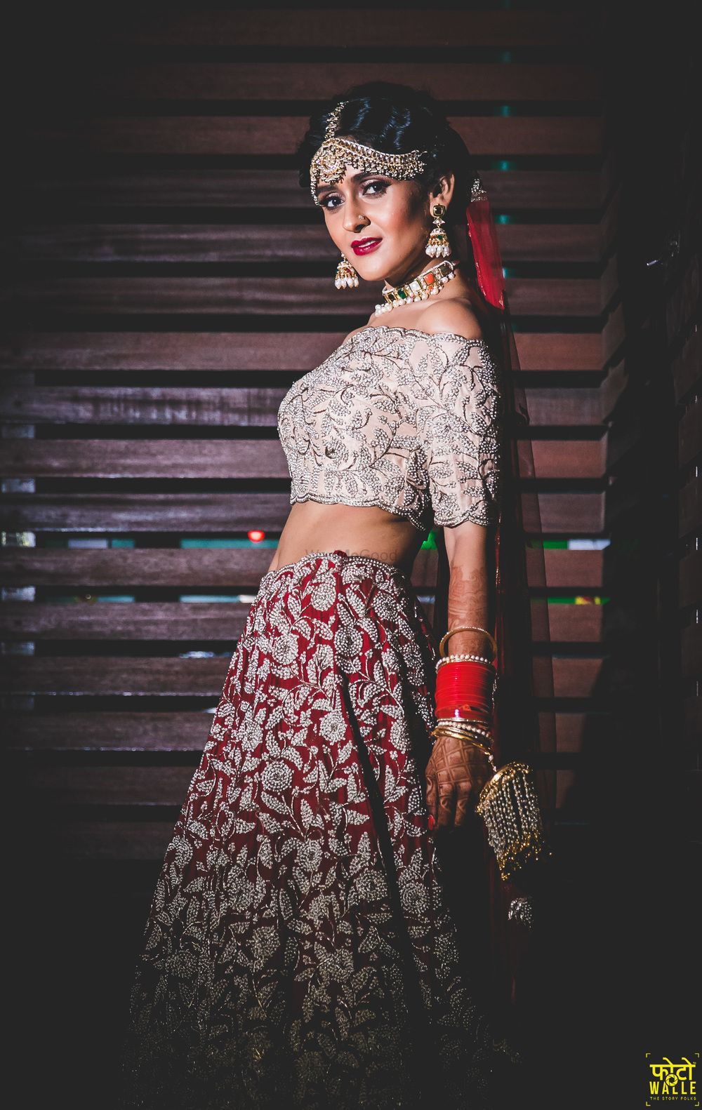 Photo of Modern bridal lehenga in silver and red with off shoulder blouse