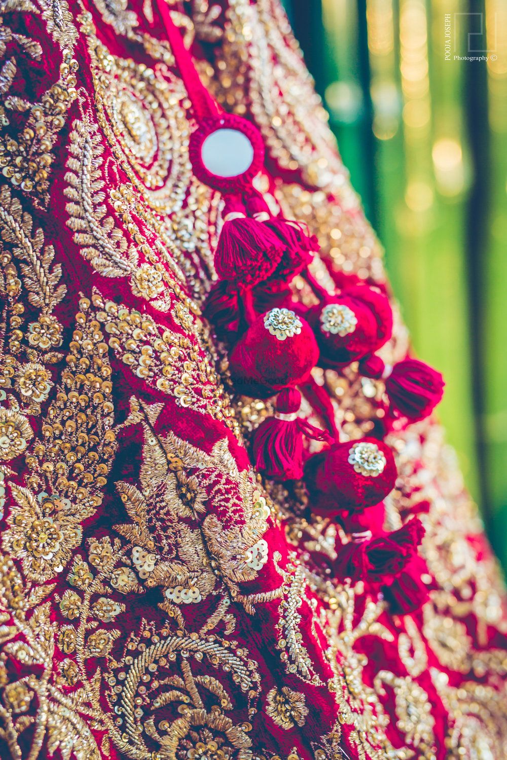 Photo of Bridal lehenga tassels with mirror work in maroon