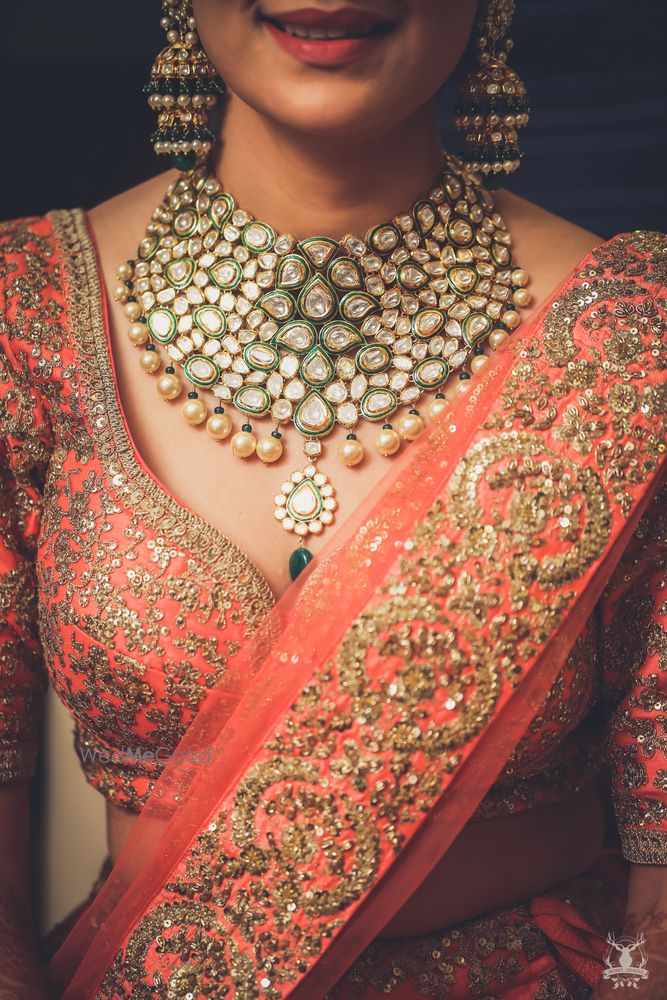 Photo of Peach bridal lehenga with choli cut blouse and polki necklace