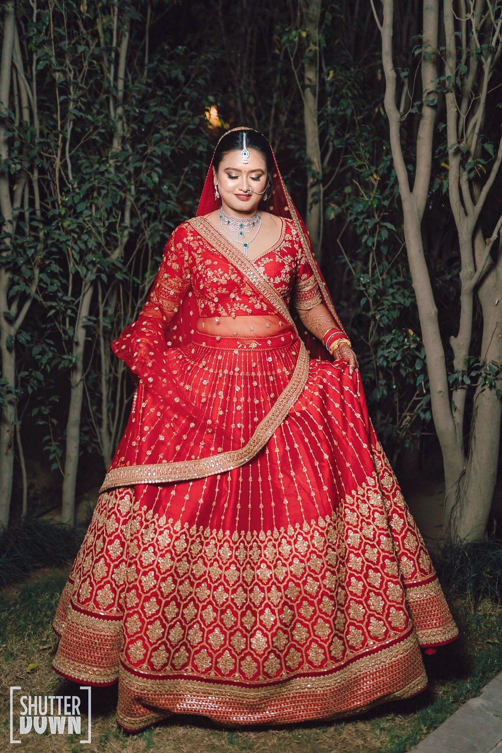Photo of bride in a red lehenga