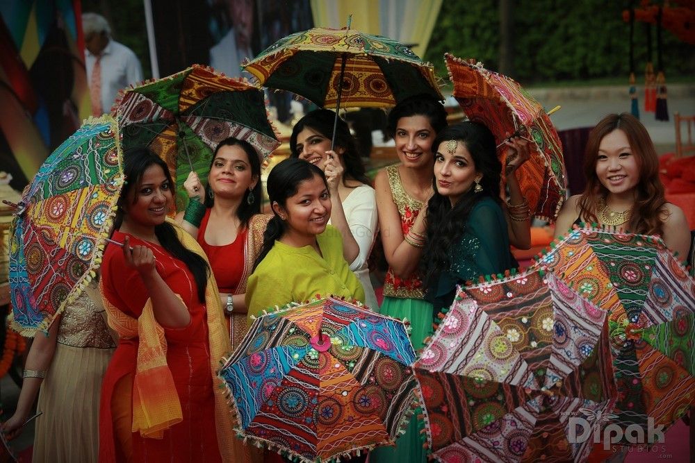 Photo of Colourful Bridesmaids Photo with Umbrella Prop