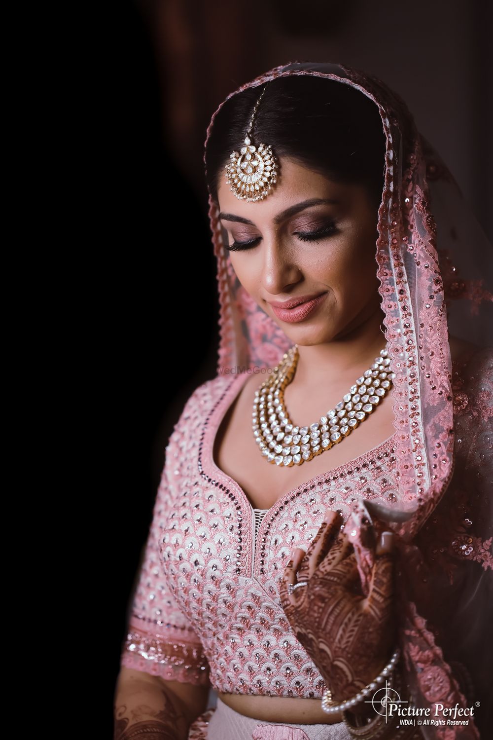 Photo of bridal makeup with pink smokey eyes