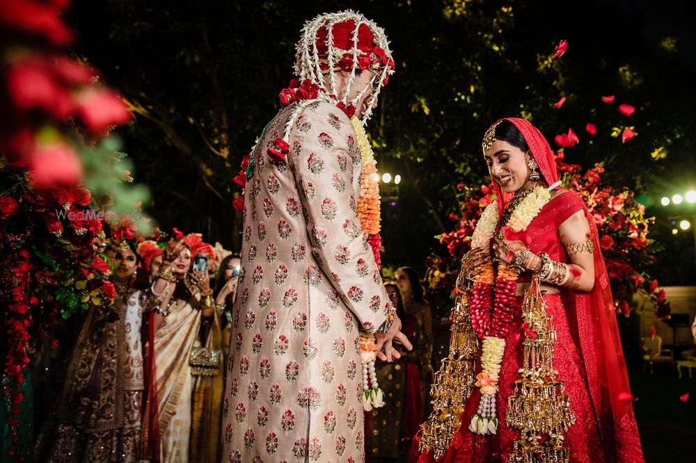 Photo of Cute candid shot during jaimala ceremony